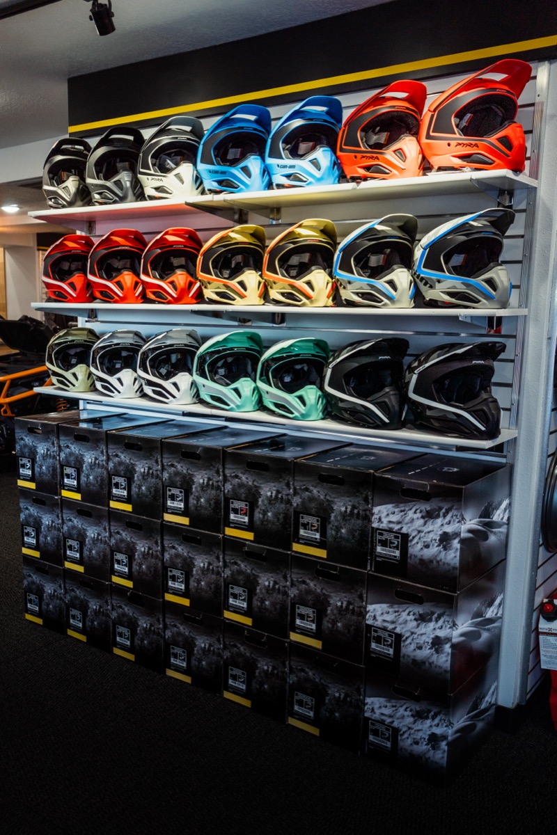 Powersports helmets and riding gear display wall at D&P Performance in Cedar City Utah