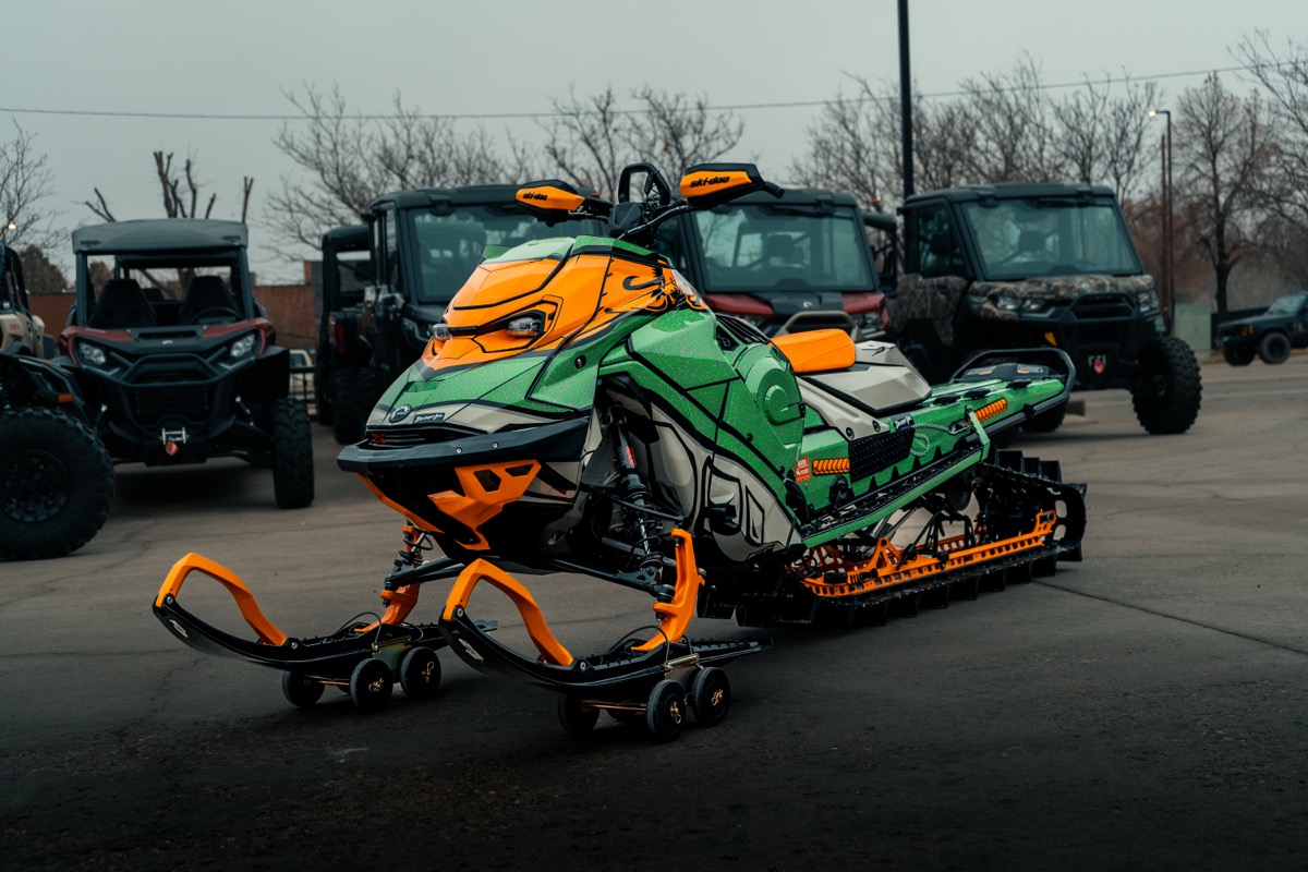 Ski-Doo snowmobile on display at D&P Performance dealership in Cedar City Utah with Can-Am UTVs in the background
