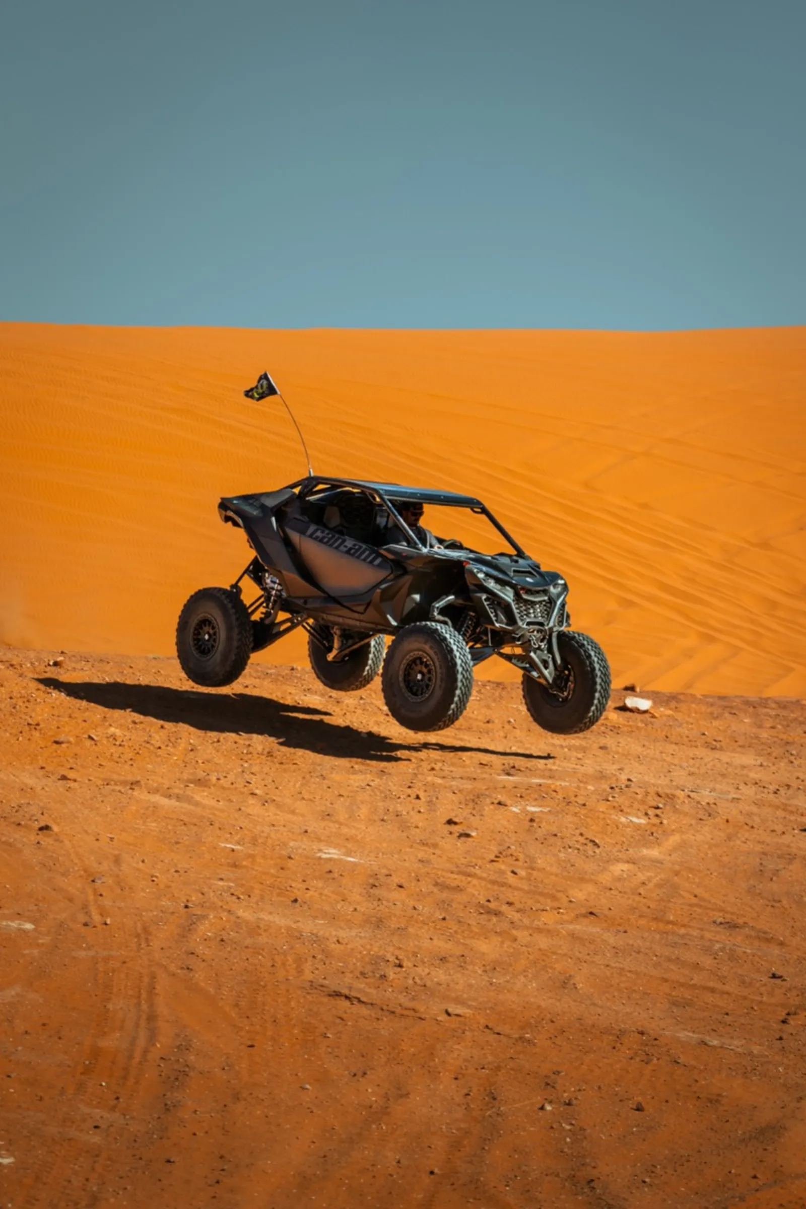 UTV jumping sand dunes at Coral Pink Sand Dunes State Park near Kanab Utah